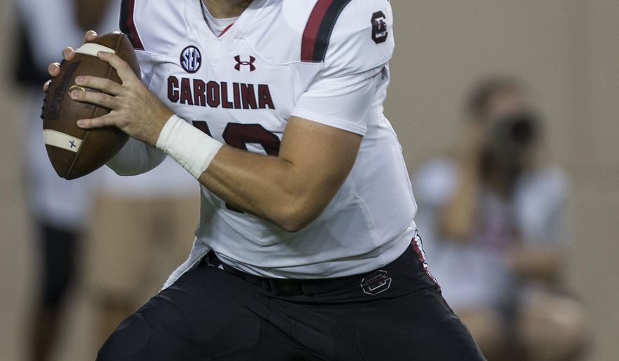 FILE - In this Sept. 30, 2017, file photo, South Carolina quarterback Jake Bentley (19) looks to pass down field against Texas A&M during the first quarter of an NCAA college football game, in College Station, Texas. After getting a firsthand look at how a quarterback switch caused South Carolina to heat up late last season, Tennessee is hoping its own shake-up provides a similar spark. South Carolina was 2-4 last season when the Gamecocks abandoned plans to redshirt Jake Bentley and moved the freshman to the top of their depth chart. Tennessee now wants to flip the script, as redshirt freshman Jarrett Guarantano makes his first career start Saturday when the Volunteers host the Gamecocks.(AP Photo/Sam Craft, File)
