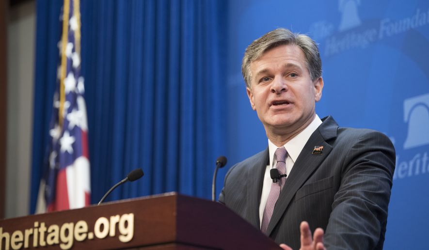FBI Director Christopher Wray speaks at a Heritage Foundation event on Section 702 of FISA on Friday, Oct. 13, 2017, in Washington. (AP Photo/Kevin Wolf) ** FILE **