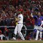 Chicago Cubs catcher Willson Contreras begins to celebrate after Washington Nationals&#39; Bryce Harper struck out swinging in the ninth inning to end Game 5 of a baseball National League Division Series, at Nationals Park, early Friday, Oct. 13, 2017, in Washington. The Cubs advanced to the NLCS with a 9-8 win. (AP Photo/Pablo Martinez Monsivais)