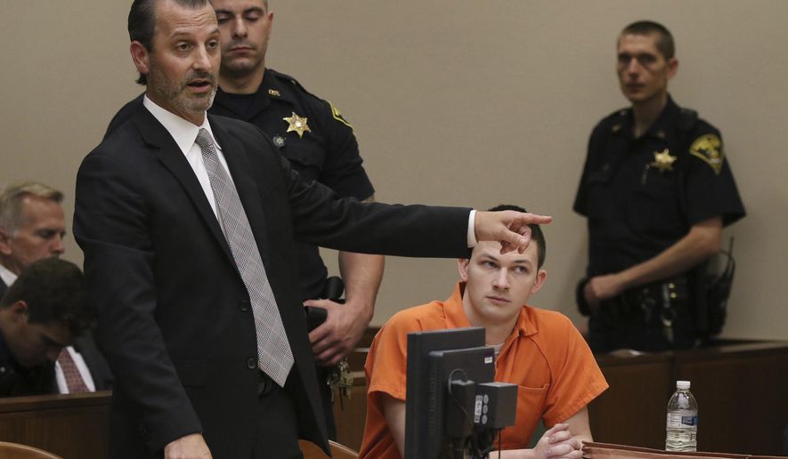 Matthew Parrinello points the finger toward Laura Rideout as he tells the judge that his client, Colin Rideout, center, was the protector in his family and often took care of his siblings growing up during his sentencing hearing on Friday, Oct. 13, 2017 in Rochester, N.Y. Rideout was sentenced to 26 years to life in prison for killing his father and disfiguring his body before dumping it in upstate New York woods. (Tina Macintyre-Yee/Rochester Democrat and Chronicle via AP)