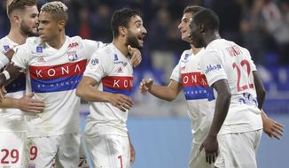 Lyon&#39;s Nabil Fekir, center, celebrates with his teammates after he scored a goal against Monaco during their French League One soccer match in Decines, near Lyon, central France, Friday, Oct. 13, 2017. (AP Photo/Laurent Cipriani)