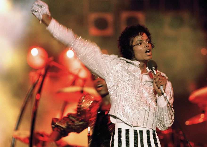 FILE - In this July 1984 file photo, Michael Jackson performs during the "Victory Tour." Julien's Auctions announced on Oct. 13, 2017, that a white glove Jackson wore on his "Triumph" tour is among several Jackson memorabilia items set to go up for bid on Nov. 4. (AP Photo, File)