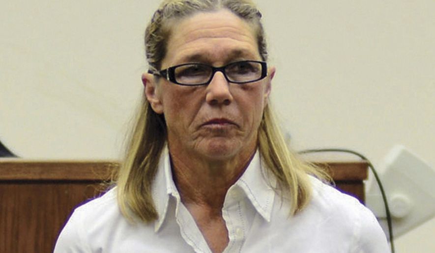 FILE - This Oct. 22, 2012 file photo shows former Dixon, Ill., comptroller Rita Crundwell in a courtroom in Dixon, Ill. A documentary detailing Crundwell's theft of nearly $54 million from the northern Illinois city is set to be shown at the Historic Dixon Theatre later this month. Crundwell is serving a 20-year sentence after pleading guilty to stealing the money over two decades to support a lavish lifestyle and a nationally renowned horse-breeding operation. (Alex T. Paschal/Sauk Valley Media via AP, File)