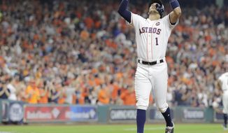 Houston Astros&#39; Carlos Correa reacts after hitting a home run during the fourth inning of Game 2 of baseball&#39;s American League Championship Series against the New York Yankees Saturday, Oct. 14, 2017, in Houston. (AP Photo/David J. Phillip)