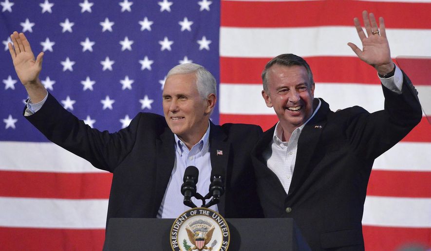 Vice President Mike Pence, left, joins Virginia Republican gubernatorial candidate Ed Gillespie onstage during a campaign rally at the Washington County Fairgrounds, Saturday, Oct. 14, 2017, in Abingdon, Va. Establishment figure Gillespie is in a neck-and-neck race against Democratic Lt. Gov. Ralph Northam. (Andre Teague/The Bristol Herald-Courier via AP)