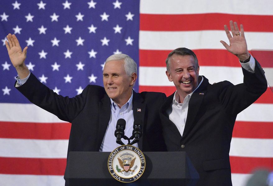 Vice President Mike Pence, left, joins Virginia Republican gubernatorial candidate Ed Gillespie onstage during a campaign rally at the Washington County Fairgrounds, Saturday, Oct. 14, 2017, in Abingdon, Va. Establishment figure Gillespie is in a neck-and-neck race against Democratic Lt. Gov. Ralph Northam. (Andre Teague/The Bristol Herald-Courier via AP)