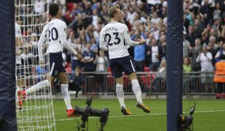 Tottenham&#39;s Christian Eriksen, right, celebrates after scoring a goal during the English Premier League soccer match between Tottenham Hotspur and AFC Bournemouth at Wembley stadium in London, Saturday Oct. 14, 2017. (AP Photo/Tim Ireland)