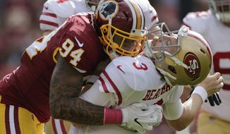 San Francisco 49ers quarterback C.J. Beathard (3) is sacked by Washington Redskins outside linebacker Preston Smith (94) during the first half of an NFL football game in Landover, Md., Sunday, Oct. 15, 2017. (AP Photo/Mark Tenally)