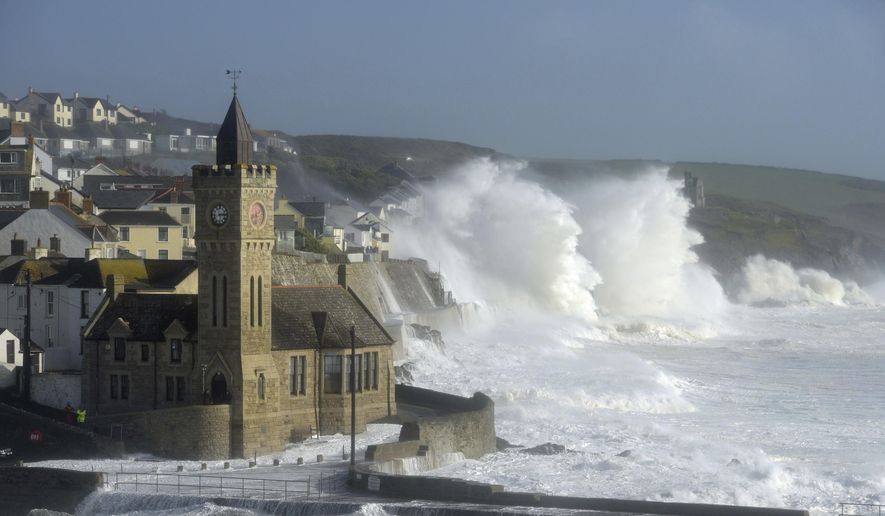 Waves break around the church in the harbour at Porthleven, Cornwall southwestern England, as the remnants of  Hurricane Ophelia begins to hit parts of Britain and Ireland. Ireland&#x27;s meteorological service is predicting wind gusts of 120 kph to 150 kph (75 mph to 93 mph), sparking fears of travel chaos. Some flights have been cancelled, and aviation officials are warning travelers to check the latest information before going to the airport Monday.  (Ben Birchall/PA via AP)