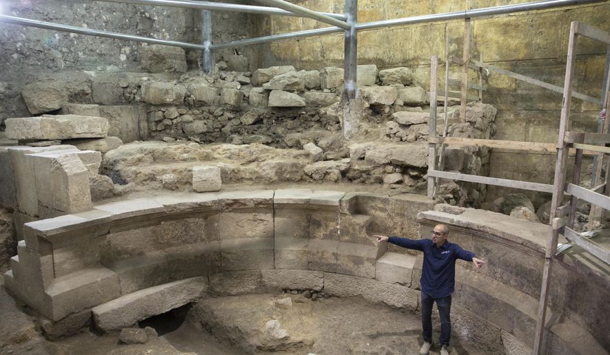 Israel's Antiquities Authority's Joe Uziel stands in an ancient Roman theater-like structure in the Western Wall tunnels in Jerusalem's old city, Monday, Oct. 16, 2017. Israeli archaeologists have announced the discovery of the first known Roman-era theater in Jerusalem's Old City, a unique 1,800-year-old structure abutting the Western Wall that is believed to have been built during Roman Emperor Hadrian's reign. (AP Photo/Sebastian Scheiner)