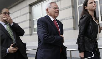 U.S. Senator Robert Menendez, center, arrives to court in Newark, N.J., Monday, Oct. 16, 2017. The judge in Menendez&#39;s corruption trial could rule on Monday to dismiss the bulk of the indictment against the New Jersey Democrat, a decision that prosecutors say could &amp;quot;broadly legalize pay-to-play politics.&amp;quot; (AP Photo/Seth Wenig)