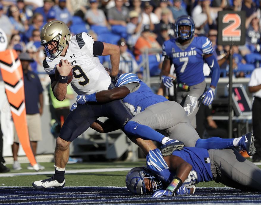 Navy quarterback Zach Abey (9) scores a touchdown on an 8-yard run against Memphis in the second half of an NCAA college football game Saturday, Oct. 14, 2017, in Memphis, Tenn. Memphis upset Navy 30-27. (AP Photo/Mark Humphrey)