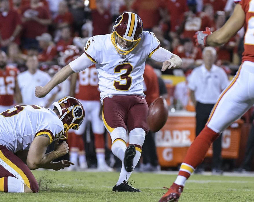 This photo taken Oct. 2, 2017, shows Washington Redskins kicker Dustin Hopkins (3) kicking a point-after during the second half of an NFL football game in Kansas City, Mo. (AP Photo/Reed Hoffmann)