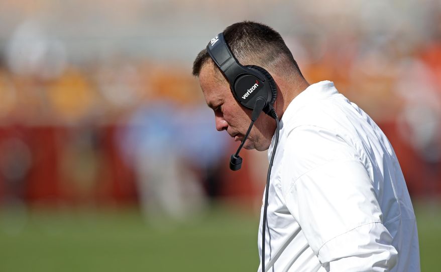 Tennessee head coach Butch Jones walks back to the sideline in the second half of an NCAA college football game against South Carolina Saturday, Oct. 14, 2017, in Knoxville, Tenn. South Carolina won 15-9. (AP Photo/Wade Payne)