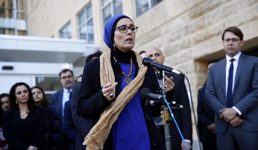 Debbie Almontaser, a board member of the Yemeni American Merchants Association, speaks at a news conference outside a federal courthouse in Greenbelt, Md., Monday, Oct. 16, 2017, following a hearing regarding three lawsuits over the Trump administration&#x27;s restrictions on travelers from certain countries. The lawsuits&#x27; plaintiffs want the judge to block the latest restrictions from going into effect Wednesday. (AP Photo/Patrick Semansky)