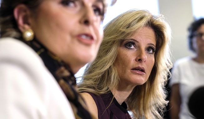 FILE - In this Oct. 14, 2016, file photo, Summer Zervos, right, listens alongside her attorney Gloria Allred during a news conference in Los Angeles. Trump’s presidential campaign has been subpoenaed for records related to past sexual assault allegations against Trump _ charges the president on Oct. 16 dismissed as “made-up stuff.” Lawyers for Zervos, a former contestant on “The Apprentice,” asked the campaign in March 2017 to preserve any records in its possession concerning Zervos or other women who accused Trump of misconduct. Zervos says Trump kissed and groped her against her will in 2007. During a Rose Garden news conference, Trump dismissed the allegations as politically motivated. (AP Photo/Ringo H.W. Chiu, file)