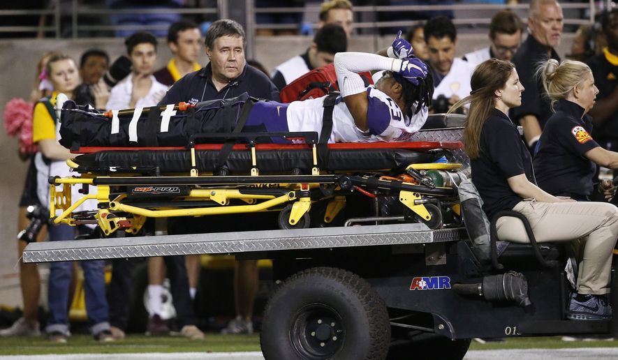 Washington defensive back Jordan Miller (23) is carted off the field due to injury during the second half of an NCAA college football game against Arizona State Saturday, Oct. 14, 2017, in Tempe, Ariz. Arizona State defeated Washington 13-7. (AP Photo/Ross D. Franklin)