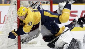 Nashville Predators center Colton Sissons (10) collides with Colorado Avalanche goalie Semyon Varlamov, of Russia, as Sissons scores a goal in the second period of an NHL hockey game Tuesday, Oct. 17, 2017, in Nashville, Tenn. (AP Photo/Mark Humphrey)