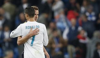 Tottenham&#39;s Harry Kane embraces Real Madrid&#39;s Cristiano Ronaldo after the end of the Group H Champions League soccer match between Real Madrid and Tottenham Hotspur at the Santiago Bernabeu stadium in Madrid, Tuesday, Oct. 17, 2017. The match ended 1-1. (AP Photo/Francisco Seco)