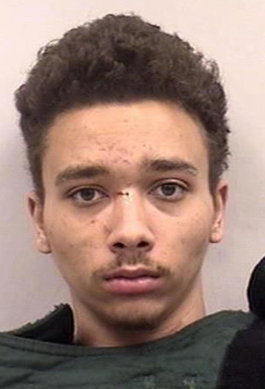 This Oct. 17, 2017 photo provided by the Colorado Springs, Colo., Police Department shows Malik Vincent Murphy, who was arrested on suspicion of fatally stabbing his younger brother and sister and also attacking his father in their Colorado home. (Colorado Springs Police Department via AP)