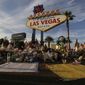 People visit a makeshift memorial for victims of the mass shooting in Las Vegas, Monday, Oct. 16, 2017, in Las Vegas. (AP Photo/John Locher)