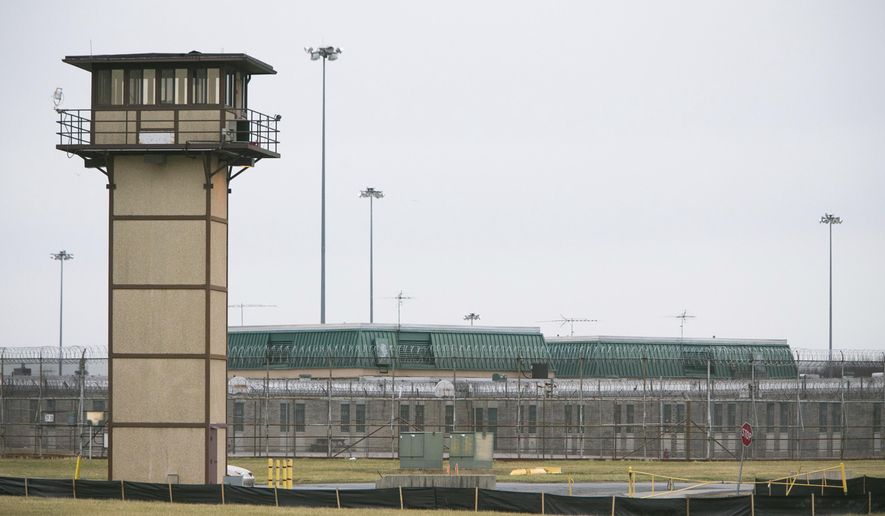 FILE - In this Feb. 1, 2017 file photo, the James T. Vaughn Correctional Center near Smyrna, Del., remains on lockdown following a riot. Delaware has charged 18 inmates in the deadly riot and hostage-taking at the state’s maximum-security prison, most of them on murder charges, according to an indictment that was made public Tuesday, Oct. 17. The riot resulted in the murder of Lieutenant Steven Floyd, injuries to Correctional Officers Winslow Smith and Joshua Wilkinson, and the kidnapping of counselor Patricia May. (Suchat Pederson /The Wilmington News-Journal via AP, File)