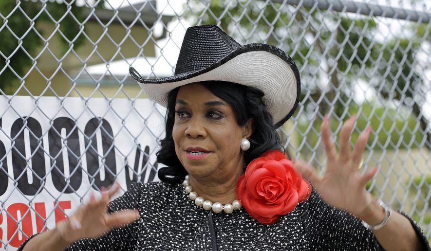 Rep. Frederica Wilson, D-Fla., talks to reporters, Wednesday, Oct. 18, 2017, in Miami Gardens, Fla. Wilson is standing by her statement that President Donald Trump told Myeshia Johnson, the widow of Sgt. La David Johnson killed in an ambush in Niger, that her husband &quot;knew what he signed up for.&quot; In a Wednesday morning tweet, Trump said Wilson&#39;s description of the call was &quot;fabricated.&quot; (AP Photo/Alan Diaz)