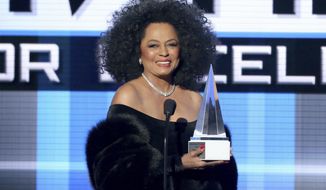 FILE - In this Nov. 23, 2014, file photo, Diana Ross presents the Dick Clark award for excellence at the 42nd annual American Music Awards. ABC and Dick Clark Productions announced on Oct. 18, 2017, that Ross would receive a lifetime achievement honor and perform at the upcoming ceremony on Nov. 19. (Photo by Matt Sayles/Invision/AP, File)
