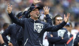 FILE - In this Sunday, Oct. 15, 2017, file photo, Chicago Bears head coach John Fox reacts in the first half of an NFL football game against the Baltimore Ravens in Baltimore. Fox has the Bears playing it safe, with few pass attempts and as many runs as possible. (AP Photo/Gail Burton, File)