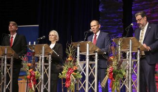FILE - In this Friday, Oct. 13, 2017 file photo, United Utah Party&#39;s Jim Bennett, from left, Democrat Dr. Kathryn Allen, Republican John Curtis and Libertarian Joe Buchman attend Utah&#39;s 3rd Congressional District debate in a race to replace Jason Chaffetz in the U.S. House of Representatives in Sandy, Utah. The three candidates running to replace Chaffetz in the U.S. House of Representatives this November are meeting in their third debate Wednesday night, Oct. 18, 2017. (AP Photo/Rick Bowmer, File)
