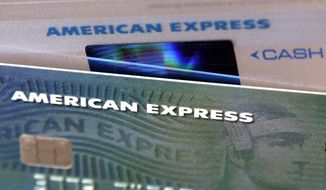 FILE - This Monday, July 18, 2016, file photo shows American Express credit cards, in North Andover, Mass. American Express Co. reports financial results, Wednesday, Oct. 18, 2017. (AP Photo/Elise Amendola, File)