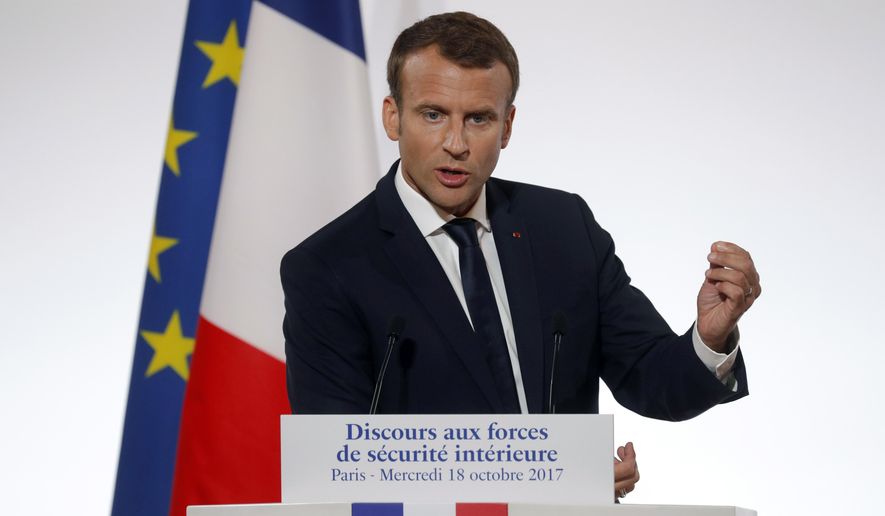 French President Emmanuel Macron delivers a speech on security to representatives of French national police, gendarmes and "Sentinelle" security plan soldiers at the Elysee Palace in Paris, France, Wednesday, Oct. 18, 2017. Macron is expected to launch a new police unit that would focus on daily life especially in working-class neighborhoods. (Philippe Wojazer/Pool Photo via AP)