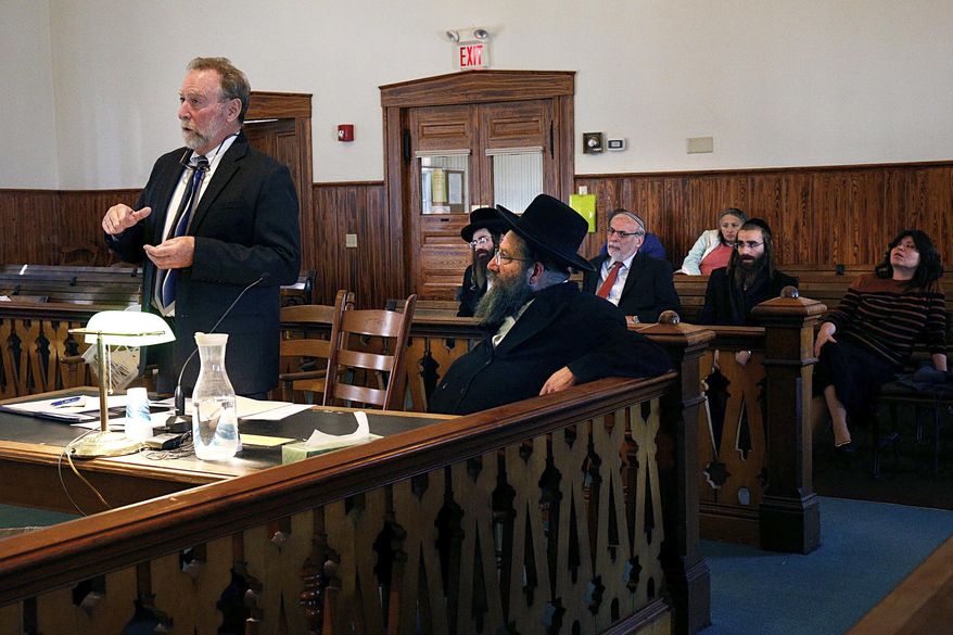 During a hearing at Orange Superior Court in Chelsea, Vt., on Wednesday, Oct. 18, 2017, defense attorney Robert Appel, left, argues there is no probable cause to charge his client Rabbi Berl Fink with a charge of attempting to elude police during an Aug. 7 traffic stop on Interstate 91 in Fairlee, Vt. Appel's motion was denied and Fink entered a not guilty plea. He is accused of failing to stop for suspected speeding for more than 4 miles on Interstate 91 in Thetford on the night of Aug. 8. (Geoff Hansen/The Valley News via AP)