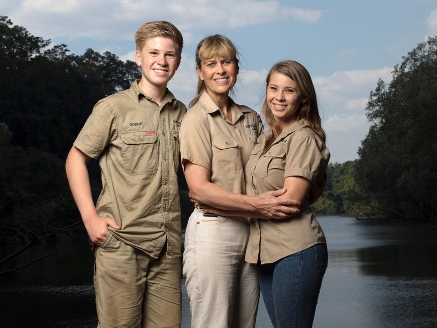 This image released by Animal Planet shows the Irwin family, from left, Robert, Terri and Bindi. The Irwin family is returning to television's Animal Planet, 11 years after the death of "The Crocodile Hunter" star and family patriarch Steve Irwin. The network announced Wednesday that they will work with Animal Planet on television and digital projects that will begin being seen next year. (