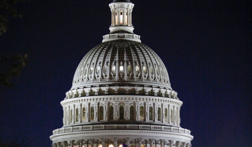 The Capitol Dome is illuminated as the Senate works into the night on a long series of votes referred to as a &quot;vote-a-rama&quot; leading up to a vote on a GOP budget, at the Capitol in Washington, Thursday, Oct. 19, 2017. (AP Photo/J. Scott Applewhite)