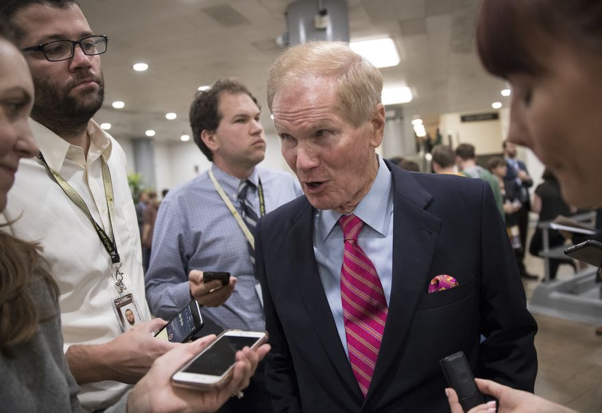 Sen. Bill Nelson, D-Fla., a member of the Senate Finance Committee, speaks with reporters during a long series of votes at the Capitol in Washington, Thursday, Oct. 19, 2017. (AP Photo/J. Scott Applewhite) ** FILE **
