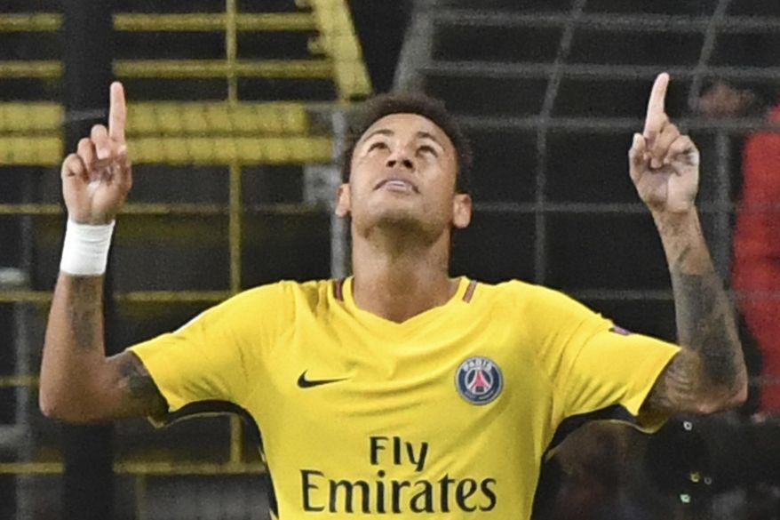 PSG's Neymar celebrates scoring his side's third goal during a Champions League Group B soccer match between Anderlecht and Paris Saint-Germain at the Constant Vanden Stock stadium in Brussels, Belgium, Wednesday, Oct. 18, 2017. (AP Photo/Geert Vanden Wijngaert)