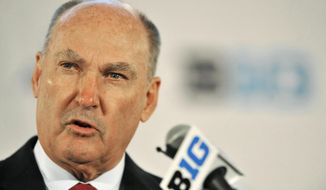 FILE - In this July 28, 2014, file photo, Big Ten Commissioner Jim Delany talks to the media during the Big Ten Football Media Day in Chicago.  The Big Ten will make its NCAA college basketball conference tournament debut at the Garden. The championship game, traditionally played on selection Sunday, will be played a week earlier on March 4. (AP Photo/Paul Beaty, File)