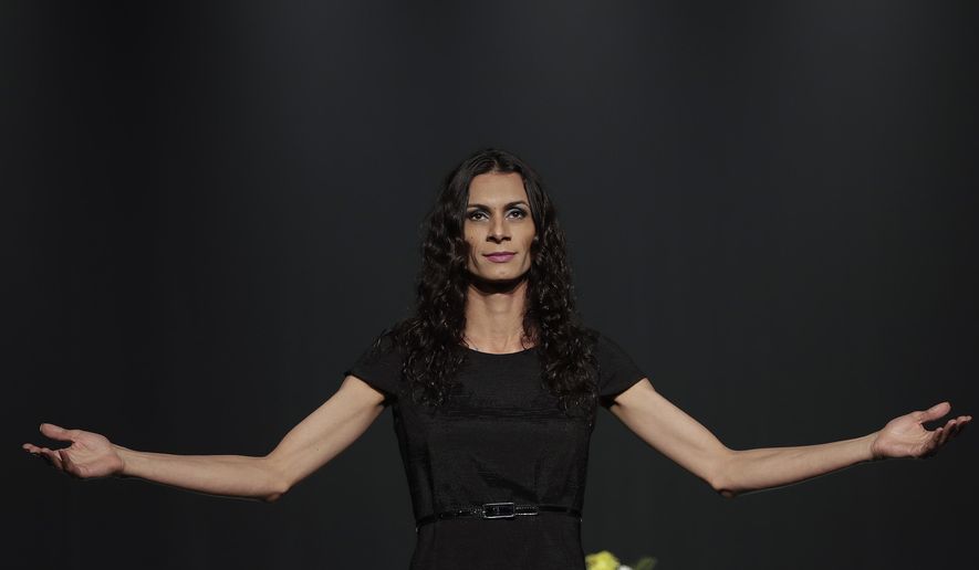 In this Sept. 27, 2017 photo, transgender actress Renata Carvalho plays the role of Jesus in the play "The Gospel According to Jesus, Queen of Heaven" in Sao Paulo, Brazil. The play in which Jesus is reimagined as a transgender woman who tells Biblical stories of tolerance has been performed more than 60 times during a tour of Brazil, but conservatives have called it offensive to Christians and petitioned courts to ban its performances. (AP Photo/Andre Penner)