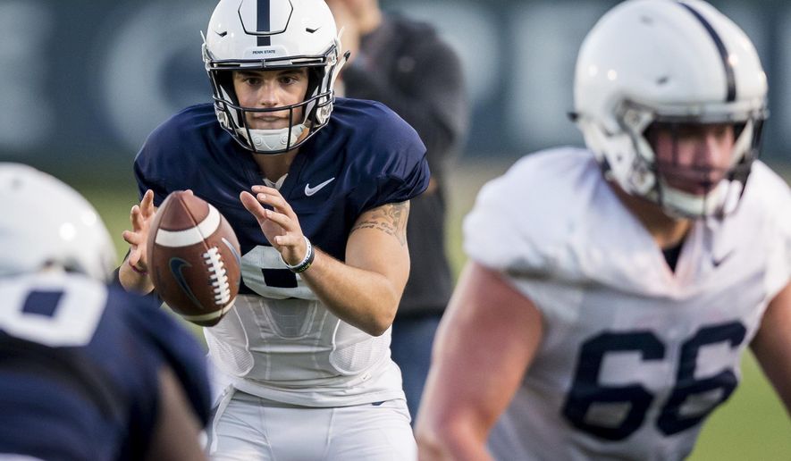 Penn State quarterback Trace McSorley takes the snap during football practice, Wednesday, Oct. 18, 2017 in State College, Pa. (Joe Hermitt/PennLive.com via AP)