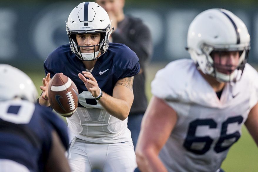Penn State quarterback Trace McSorley takes the snap during football practice, Wednesday, Oct. 18, 2017 in State College, Pa. (Joe Hermitt/PennLive.com via AP)