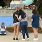 This photo taken Aug. 31, 2017, file shows students pausing to reflect at a memorial at Powell Middle School set up for a student who recently took their own life in Littleton, Colo. The young student took his own life at Twain Elementary School. Two young students from Littleton Public Schools have taken their own lives over a two-day period concerning parents, students and schools. (Helen H. Richardson/The Denver Post via AP) ** FILE **