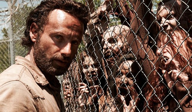 Rick Grimes meets &quot;The Walking Dead.&quot; (Couretsy AMC)