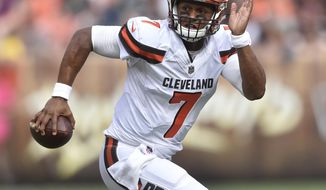 FILE - In this Oct. 8, 2017, file photo, Cleveland Browns quarterback DeShone Kizer (7) runs with the ball during an NFL football game against the New York Jets, in Cleveland. The Browns play the Titans in Cleveland on Sunday. (AP Photo/David Richard, File)