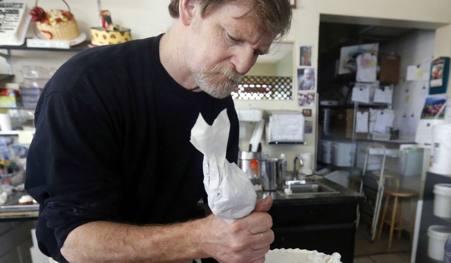 Masterpiece Cakeshop owner Jack Phillips decorates a cake inside his store in Lakewood, Colo.  Prominent chefs, bakers and restaurant owners want the Supreme Court to rule against a Colorado baker who wouldn’t make a cake for a same-sex couple’s wedding. The food makers say that once they open their doors for business, they don’t get to choose their customers.  (AP Photo/Brennan Linsley, File)
