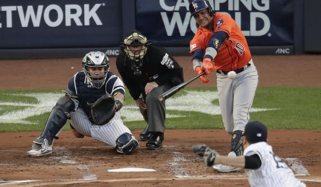 Houston Astros&#x27; Yuli Gurriel hits a double during the second inning of Game 5 of baseball&#x27;s American League Championship Series against the New York Yankees Wednesday, Oct. 18, 2017, in New York. (AP Photo/Frank Franklin II)