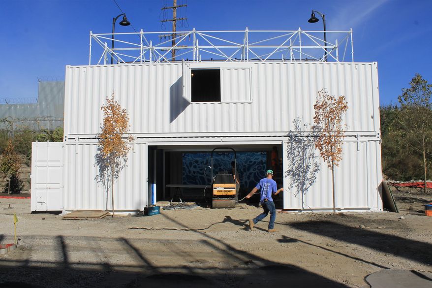 This photo provided by Detroit RiverFront Conservancy shows the Dequindre Cut Freight Yard project in Detroit on Thursday, Oct. 19, 2017. The new retail and entertainment gathering space made of repurposed shipping containers is scheduled to open in the spring of 2018. (Marc Pasco/ Detroit RiverFront Conservancy via AP)