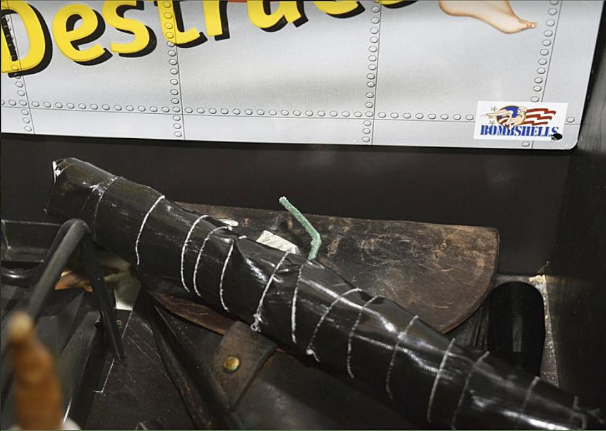 In this undated photo released by the Pinellas County Sheriff's Office, an improvised explosive device is shown in the home of Randall Drake. Sheriff's deputies conducting a child porn raid on the home found an arsenal of guns and explosives and a homemade silencer, along with a note promising "bloody revenge." Pinellas County Sheriff Bob Gualtieri told reporters Thursday night, Oct. 19, 2017, deputies also found aerial images of two schools and a water plant in nearby Tampa. There was also a note that deputies believe Drake wrote, promising he'll have his "bloody revenge" and "the world will burn burn." (Pinellas County Sheriff's Office via AP)