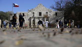 FILE - In this Feb. 23, 2016, file photo, guests visit the grounds of the Alamo in San Antonio. Texas Land Commissioner George P. Bush is overseeing a 7-year, $450 million revamp of the Alamo, where 189 independence fighters were killed in 1836. That includes restoration of historical structures and building a new museum and visitors&#39; center. But some conservatives worry that the importance of the battle for the Alamo will be marginalized by &amp;quot;political correctness,&amp;quot; with the overhaul sanitizing less-desirable aspects of participants&#39; history, including that some were slaveholders. (AP Photo/Eric Gay, File)