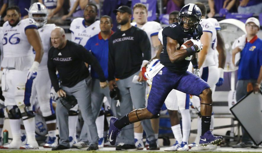 TCU wide receiver John Diarse (9) takes a pass to the end zone to score a touchdown against Kansas during the first half of an NCAA college football game Saturday, Oct. 21, 2017, in Fort Worth, Texas. (AP Photo/Ron Jenkins)